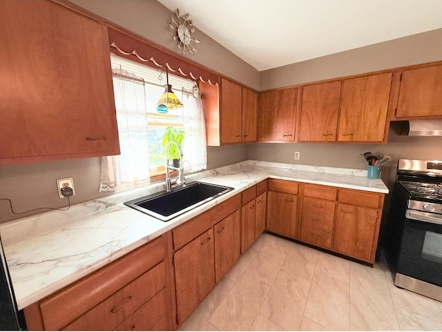 1217 S 7th Ave, Kankakee, IL 60901 - kitchen featuring gas range, range hood, and brown cabinetry