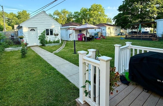 1217 S 7th Ave, Kankakee, IL 60901 - view of yard with a deck and an outbuilding