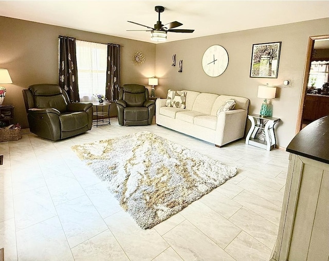 1217 S 7th Ave, Kankakee, IL 60901 - living room with ceiling fan, healthy amount of natural light, and light marble finish floors