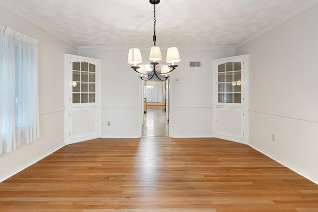 1405 1st Ave, Sterling, IL 61081 - unfurnished room with a chandelier, light wood finished floors, and crown molding