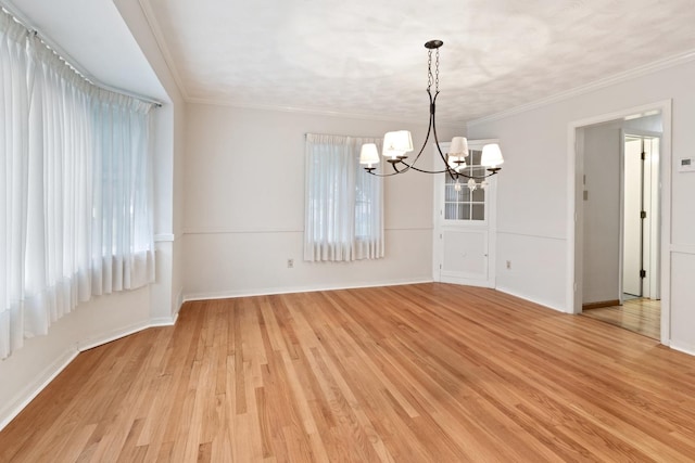 1405 1st Ave, Sterling, IL 61081 - spare room featuring a chandelier, light wood-style floors, and crown molding