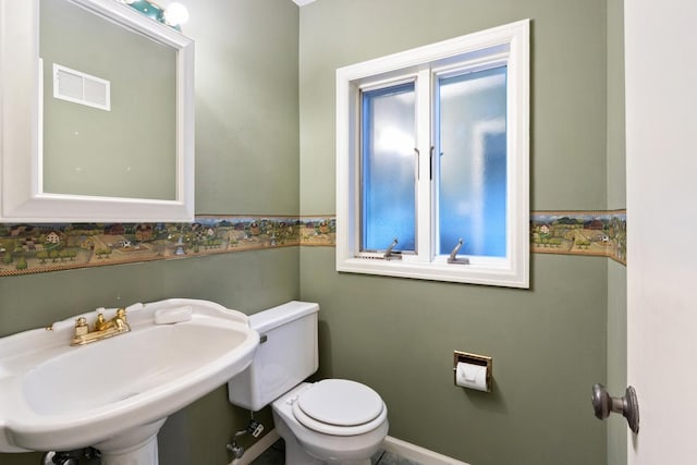 1405 1st Ave, Sterling, IL 61081 - half bathroom with wainscoting and plenty of natural light