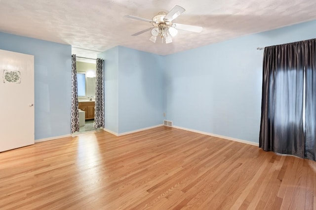 1405 1st Ave, Sterling, IL 61081 - empty room featuring light wood-style floors and ceiling fan