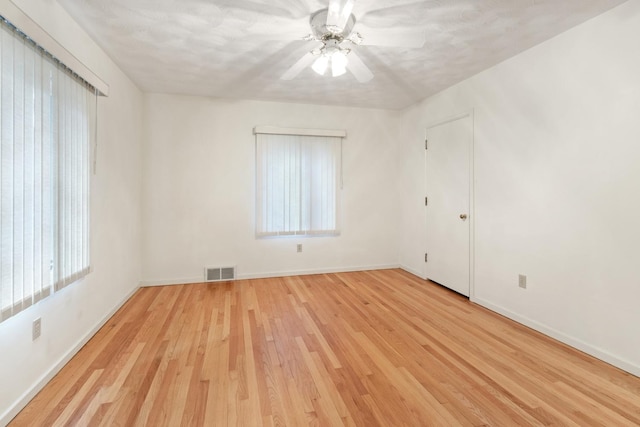 1405 1st Ave, Sterling, IL 61081 - empty room with light wood finished floors and ceiling fan