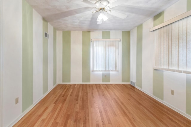 1405 1st Ave, Sterling, IL 61081 - empty room featuring wood finished floors and a ceiling fan