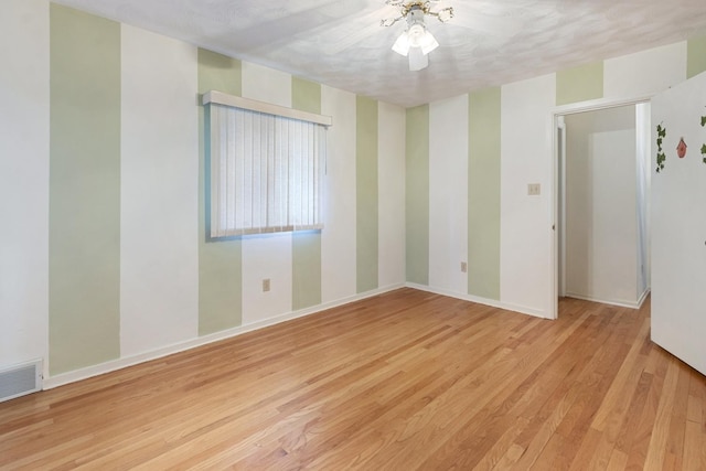 1405 1st Ave, Sterling, IL 61081 - unfurnished room with wood finished floors and baseboards