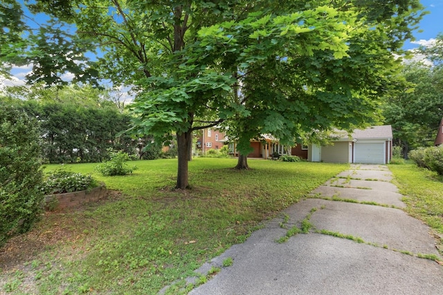 1405 1st Ave, Sterling, IL 61081 - view of grassy yard featuring an attached garage and driveway