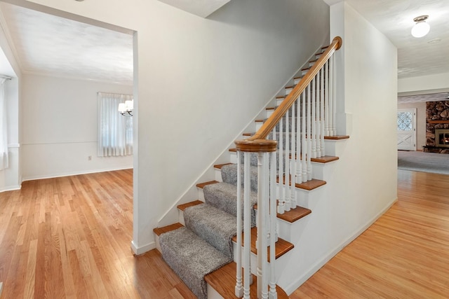 1405 1st Ave, Sterling, IL 61081 - stairway with wood finished floors and a chandelier