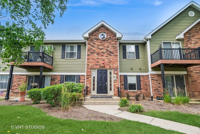 1336 Mcdowell Rd Unit 201, Naperville, IL 60563 - view of front of house with a balcony and brick siding