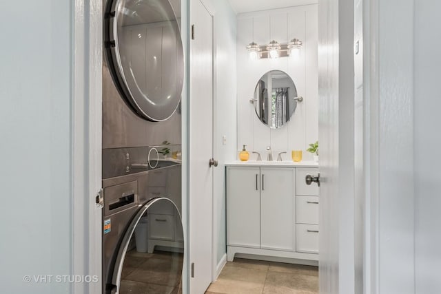 1336 Mcdowell Rd Unit 201, Naperville, IL 60563 - laundry room with stacked washing machine and dryer and light tile patterned floors