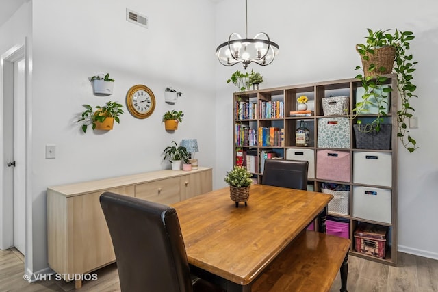 1336 Mcdowell Rd Unit 201, Naperville, IL 60563 - dining space with a chandelier and wood finished floors