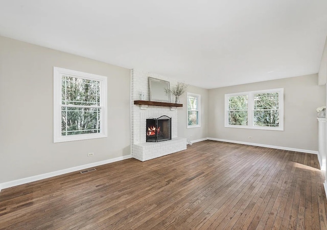 1168 Banbury Cir, Naperville, IL 60540 - unfurnished living room featuring dark wood-style flooring and a fireplace