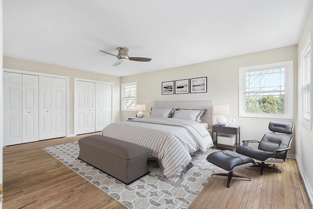 1168 Banbury Cir, Naperville, IL 60540 - bedroom featuring wood finished floors, multiple closets, and a ceiling fan