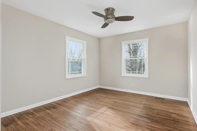 1168 Banbury Cir, Naperville, IL 60540 - empty room featuring plenty of natural light, a ceiling fan, and hardwood / wood-style floors