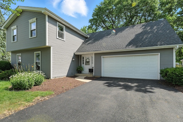 1168 Banbury Cir, Naperville, IL 60540 - view of front of home with driveway, an attached garage, and roof with shingles
