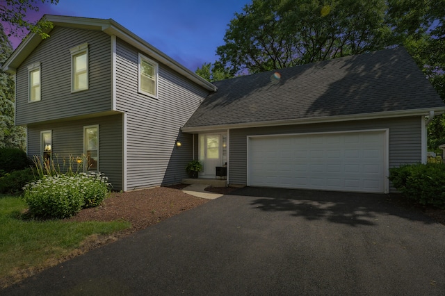 1168 Banbury Cir, Naperville, IL 60540 - view of front facade featuring driveway and a garage