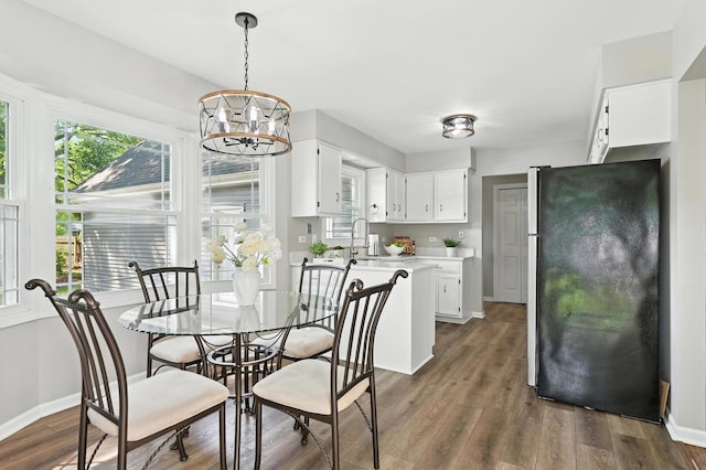 1168 Banbury Cir, Naperville, IL 60540 - dining area with a chandelier and dark wood-style floors