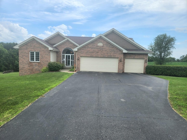 7227 Hawthorne Rdg, Roscoe, IL 61073 - view of front of house featuring driveway, a front lawn, an attached garage, and brick siding
