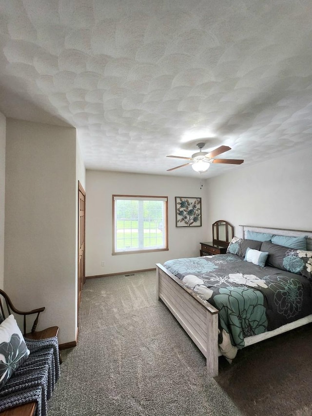 7227 Hawthorne Rdg, Roscoe, IL 61073 - carpeted bedroom with a textured ceiling and a ceiling fan