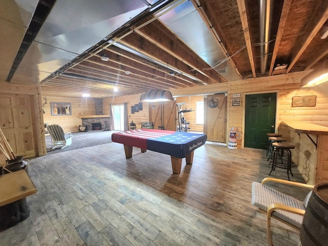 7227 Hawthorne Rdg, Roscoe, IL 61073 - rec room featuring pool table, wood finished floors, a stone fireplace, and wooden walls