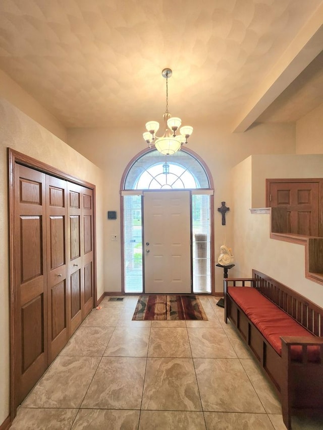 7227 Hawthorne Rdg, Roscoe, IL 61073 - entrance foyer with a chandelier and light tile patterned flooring