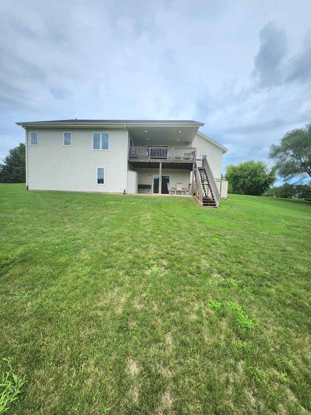 7227 Hawthorne Rdg, Roscoe, IL 61073 - back of property with stairway, a wooden deck, and a yard