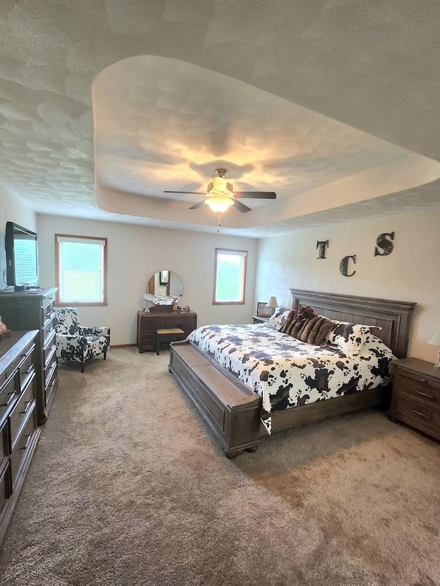 7227 Hawthorne Rdg, Roscoe, IL 61073 - bedroom with carpet floors, a tray ceiling, and ceiling fan