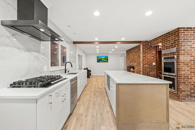 8019 S Malta Rd, Dekalb, IL 60115 - kitchen featuring wall chimney exhaust hood, appliances with stainless steel finishes, light wood-style flooring, a kitchen island, and recessed lighting
