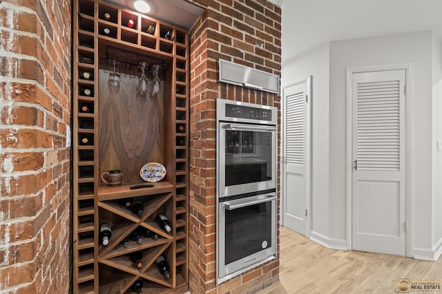 8019 S Malta Rd, Dekalb, IL 60115 - wine room featuring wood finished floors and baseboards
