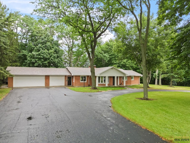 8019 S Malta Rd, Dekalb, IL 60115 - single story home featuring driveway, an attached garage, a front yard, and brick siding