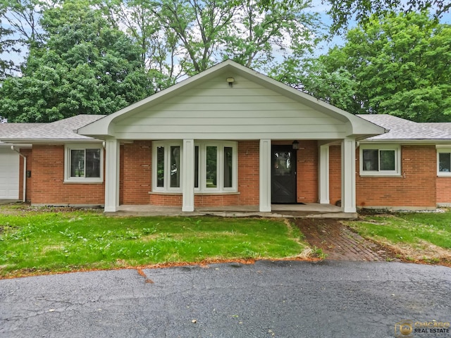 8019 S Malta Rd, Dekalb, IL 60115 - single story home featuring brick siding, a garage, and roof with shingles