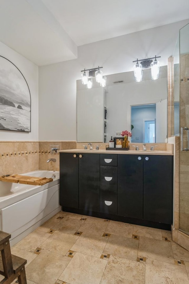 2144 W Schiller St Unit H, Chicago, IL 60622 - bathroom with double vanity, a garden tub, a shower stall, and tile walls