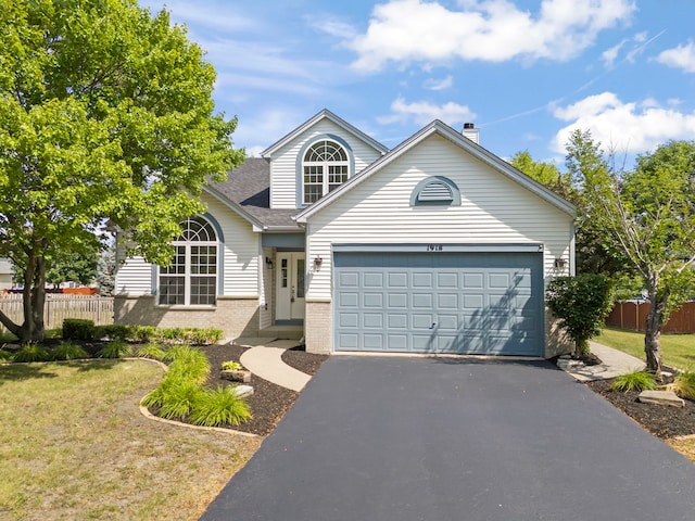 1918 Prairie Ridge Ct, Plainfield, IL 60586 - traditional-style house with brick siding, driveway, a garage, a chimney, and a shingled roof