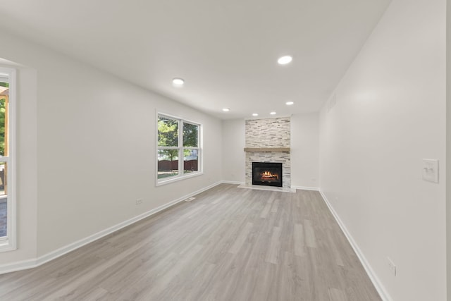 1918 Prairie Ridge Ct, Plainfield, IL 60586 - unfurnished living room featuring light wood-style floors, a large fireplace, and recessed lighting