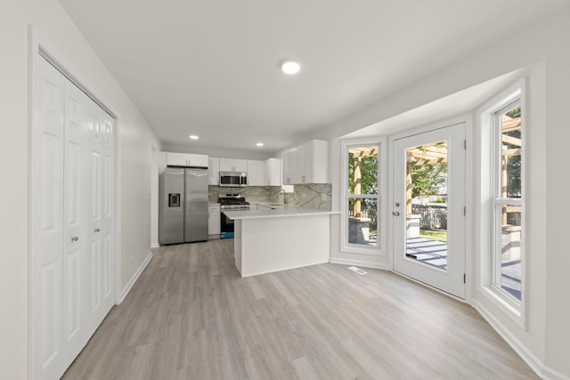 1918 Prairie Ridge Ct, Plainfield, IL 60586 - kitchen featuring appliances with stainless steel finishes, light wood-style flooring, light countertops, decorative backsplash, and recessed lighting