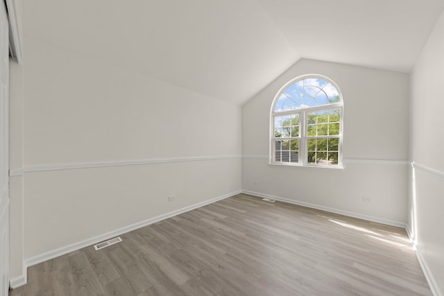 1918 Prairie Ridge Ct, Plainfield, IL 60586 - empty room with lofted ceiling and wood finished floors