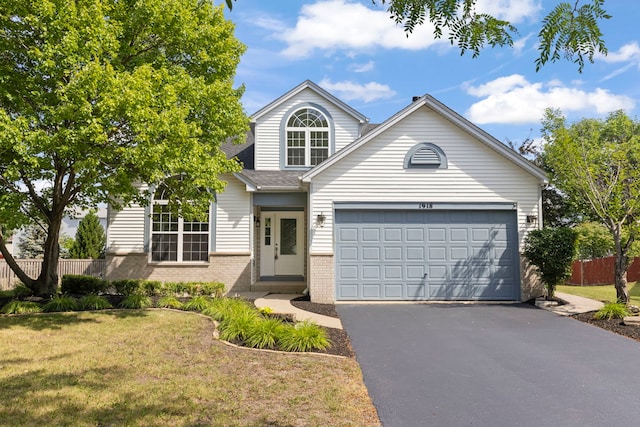 1918 Prairie Ridge Ct, Plainfield, IL 60586 - traditional-style house with brick siding, driveway, a garage, and roof with shingles