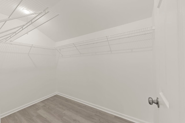 1918 Prairie Ridge Ct, Plainfield, IL 60586 - spacious closet featuring wood finished floors and vaulted ceiling