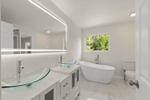 1918 Prairie Ridge Ct, Plainfield, IL 60586 - bathroom with marble look tile flooring, a freestanding bath, and double vanity