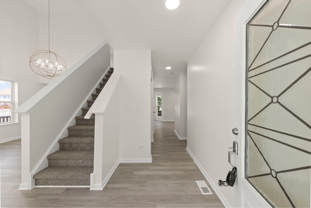 1918 Prairie Ridge Ct, Plainfield, IL 60586 - foyer entrance with recessed lighting, stairway, light wood-style flooring, and a chandelier