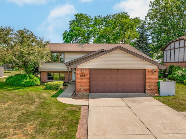 13301 Maverick Trl, Homer Glen, IL 60491 - view of front facade with brick siding, driveway, a front yard, and a garage