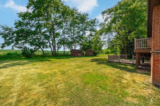 13301 Maverick Trl, Homer Glen, IL 60491 - view of green lawn with a storage unit and a deck