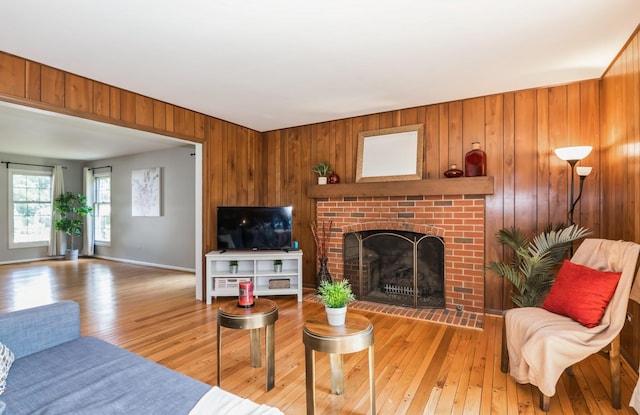 200 Timbercrest Dr, Schaumburg, IL 60193 - living room with light wood finished floors, a fireplace, and wood walls
