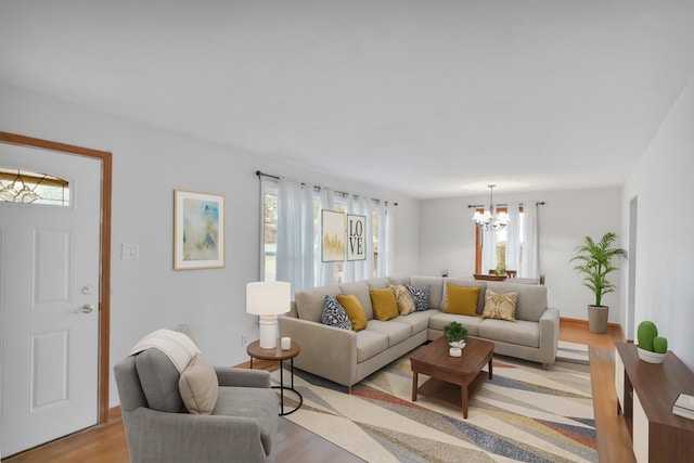 21130 Kildare Ave, Matteson, IL 60443 - living room with healthy amount of natural light, a chandelier, and light wood-style flooring