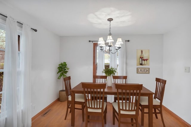 21130 Kildare Ave, Matteson, IL 60443 - dining space featuring a chandelier and light wood-style flooring