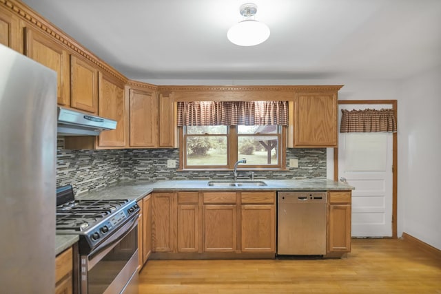 21130 Kildare Ave, Matteson, IL 60443 - kitchen with appliances with stainless steel finishes, under cabinet range hood, backsplash, and light wood-style floors