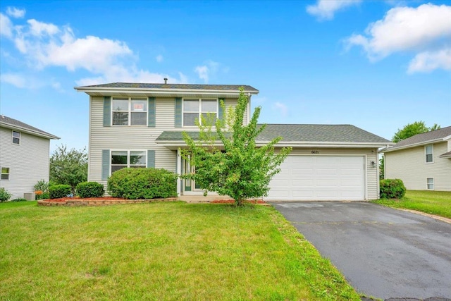 6621 Samantha Ln, Rockford, IL 61107 - traditional-style house featuring asphalt driveway, an attached garage, and a front lawn