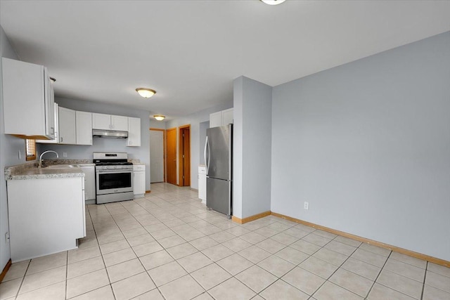 6621 Samantha Ln, Rockford, IL 61107 - kitchen featuring range with gas cooktop, freestanding refrigerator, under cabinet range hood, light countertops, and white cabinetry