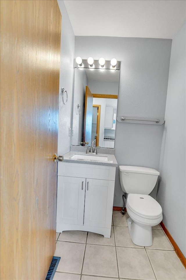 6621 Samantha Ln, Rockford, IL 61107 - half bathroom featuring vanity and tile patterned floors