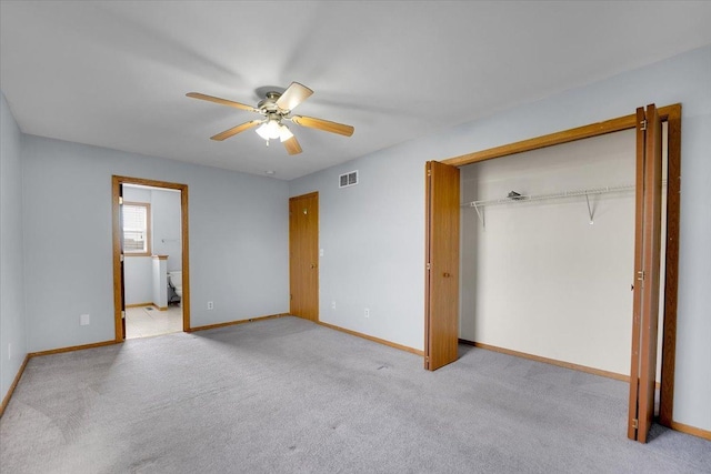 6621 Samantha Ln, Rockford, IL 61107 - unfurnished bedroom with light carpet, a closet, a ceiling fan, and connected bathroom